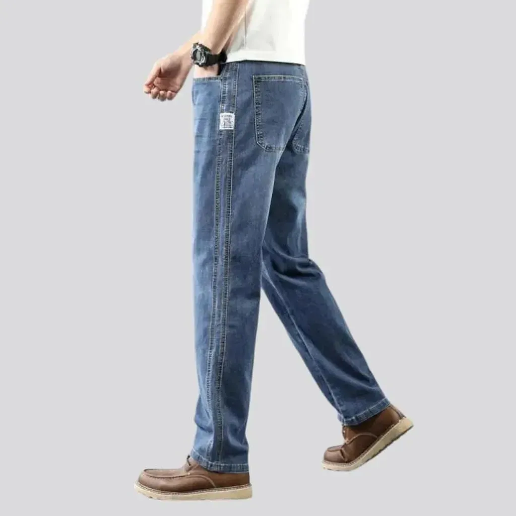 Thin men's whiskered jeans