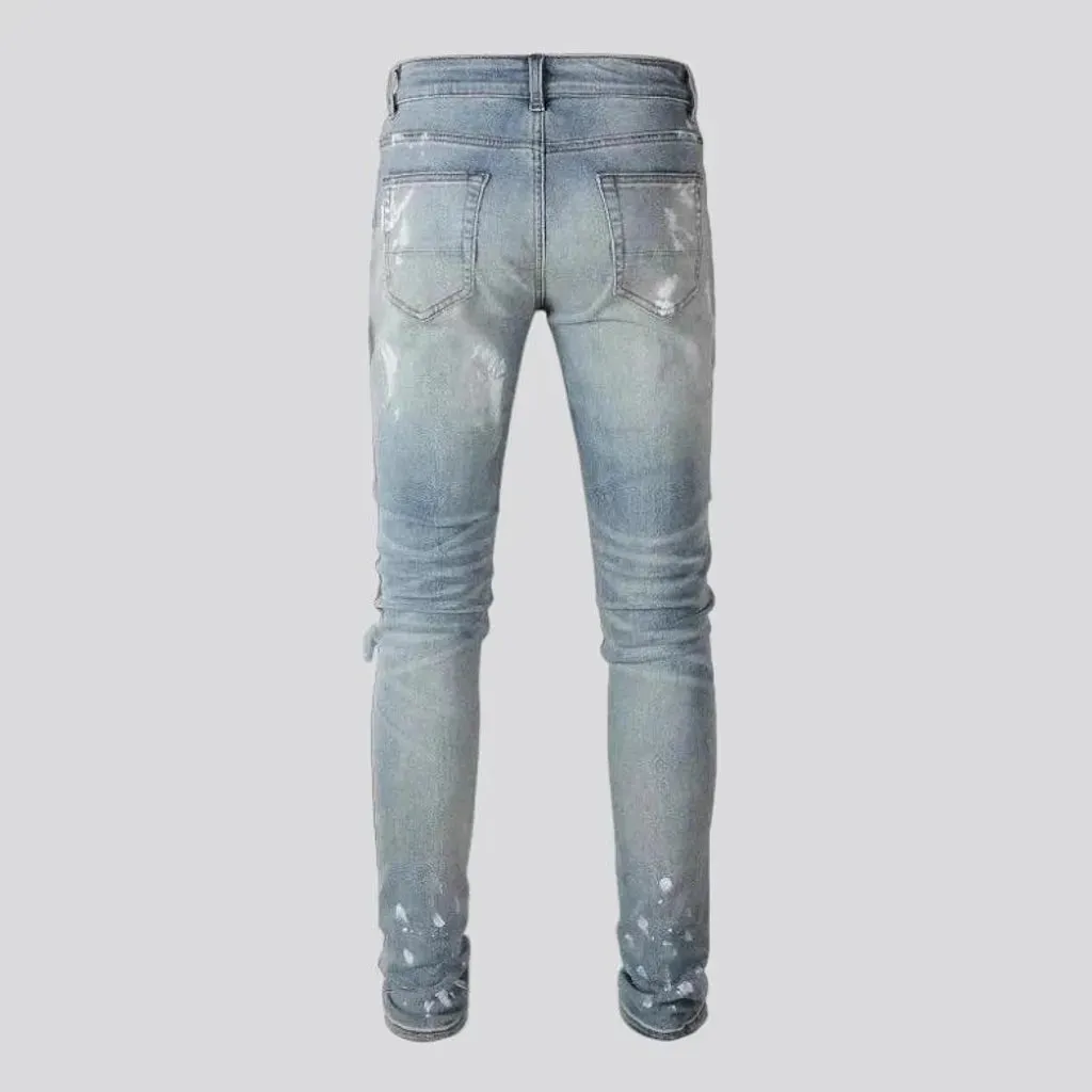 Tight men's frayed jeans